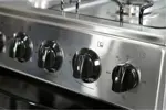 Cocina Multigas 5538 - 56cm, Encendido Eléctrico, Horno Easy Clean, Acero Inox